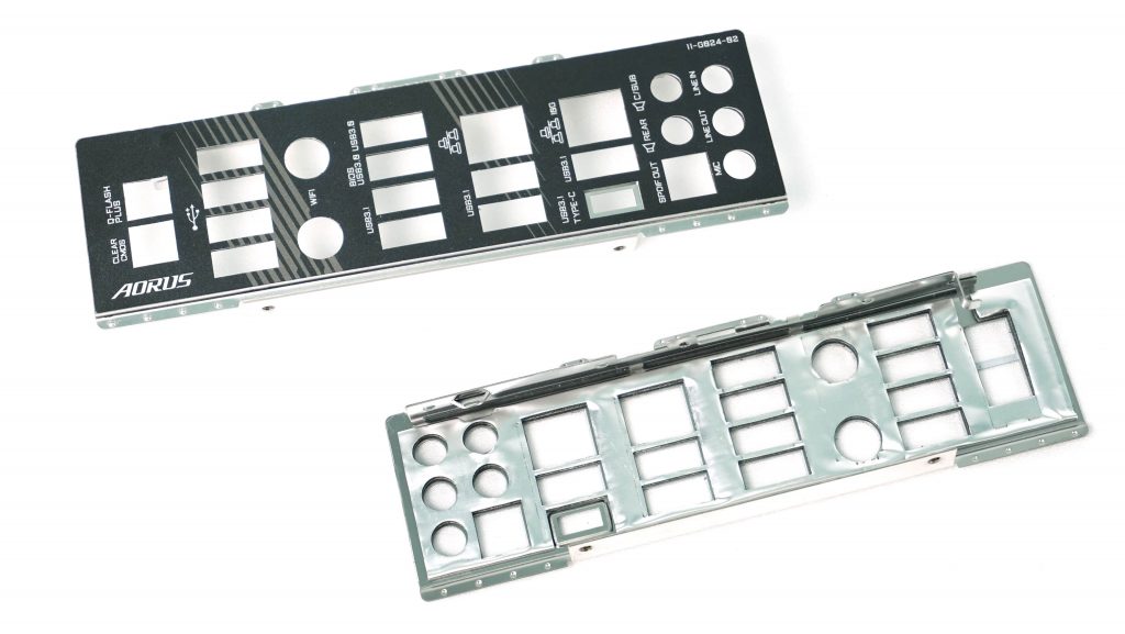 The rear I/O shield. If it is not permanently attached to the board from the factory, don't forget to install it in the case before mounting the board. If you remove the board from a PC, keep this part with it so it doesn't get lost